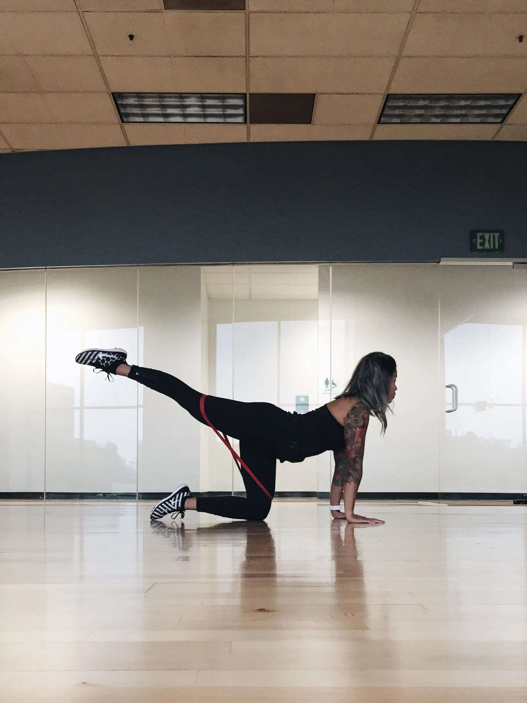 Straight leg donkey kicks -For the donkey kicks place the band above your knees, straighten one leg and lift up squeezing your glute, lower down with control. 