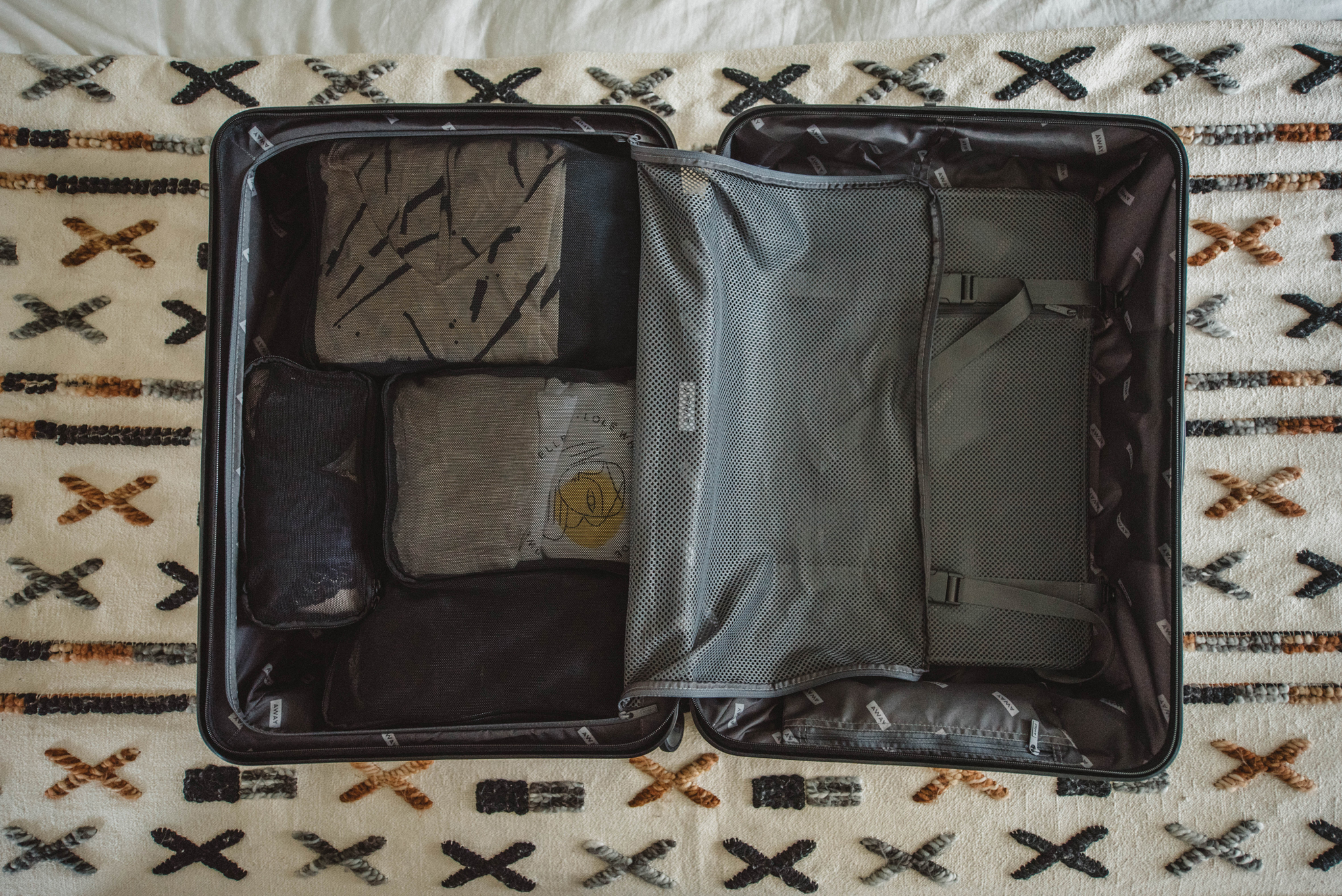 Featured here is 4 Away packing cubes (I own the 6 pack) and the Medium Sized Away Luggage || Get $20 OFF your first order from Away