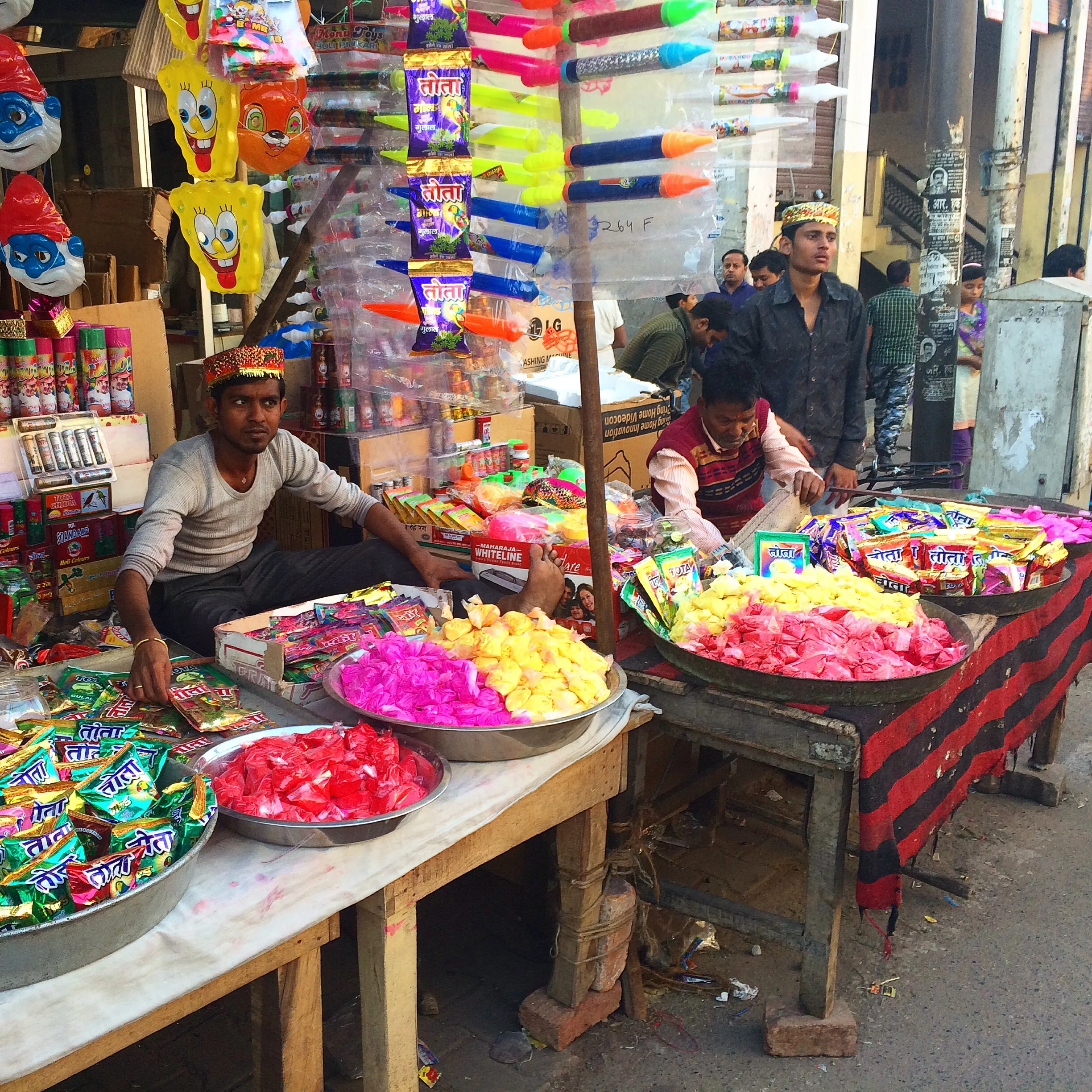 Vendors in the streets preparing for Holi.