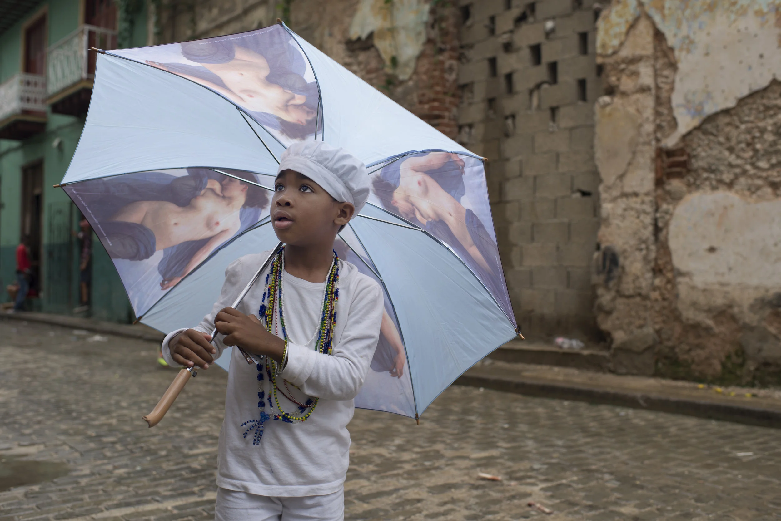 A young boy looks at American students in Old Havana, Cuba on Jan. 22, 2016. 