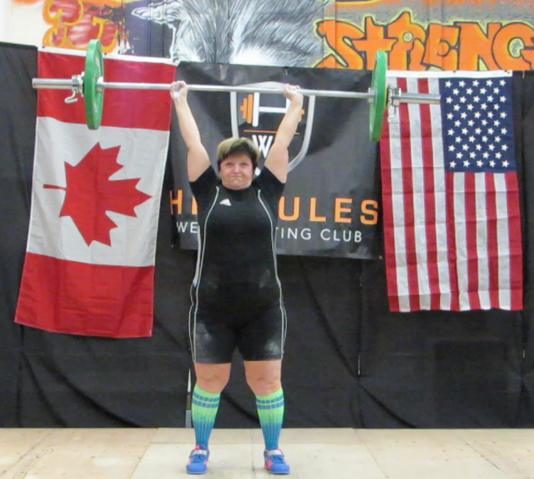 43kg Clean & Jerk (all three attempts successful, this was the last weight). Click on the image to increase the size and check out the fingers of her right hand. KDog managed to finish the lift, even though her fingers weren't all around the bar. WOW!