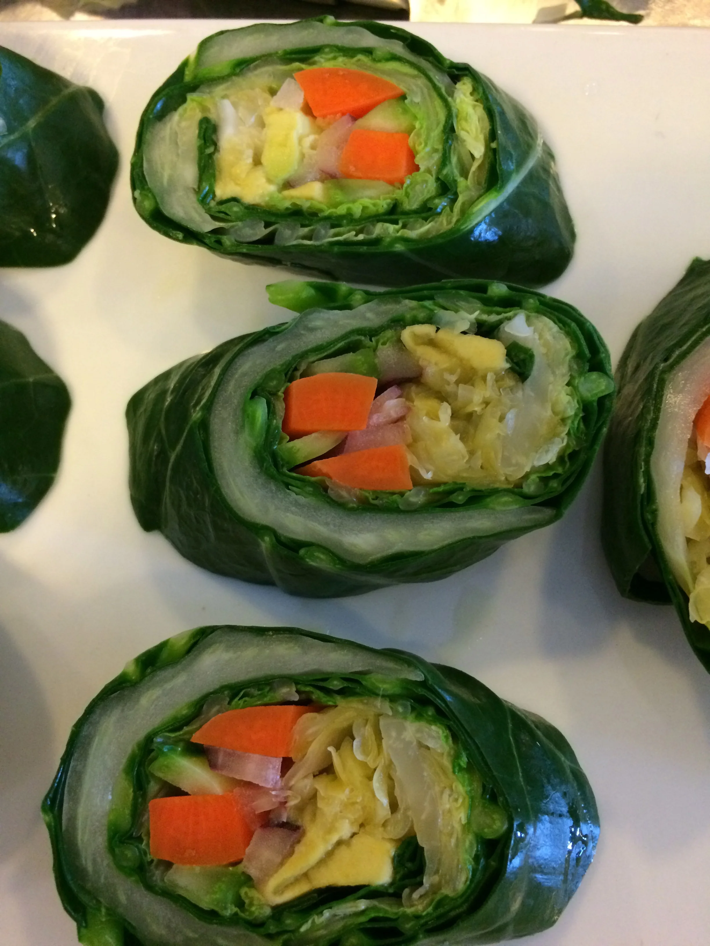 Collard wrap with sour kraut, carrot, cucumber, avocado, red onion