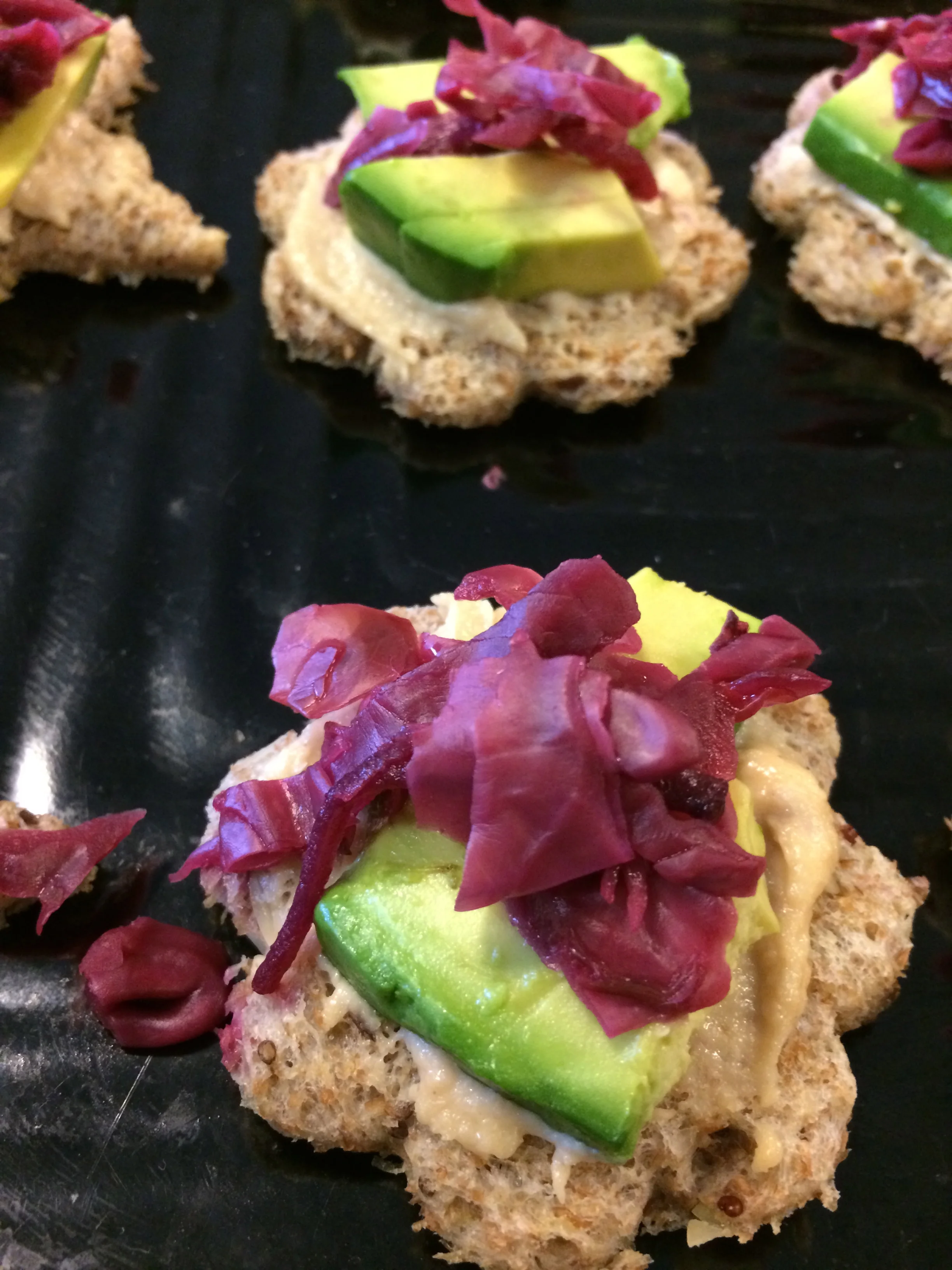 Humus and avocado snack with purple cabbage kraut