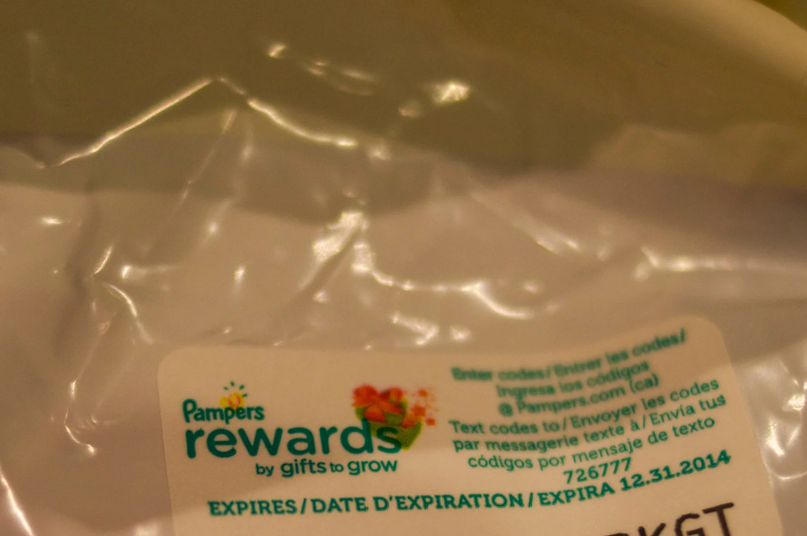 Pampers Rewards sticker with a code that you can enter into pampers.com