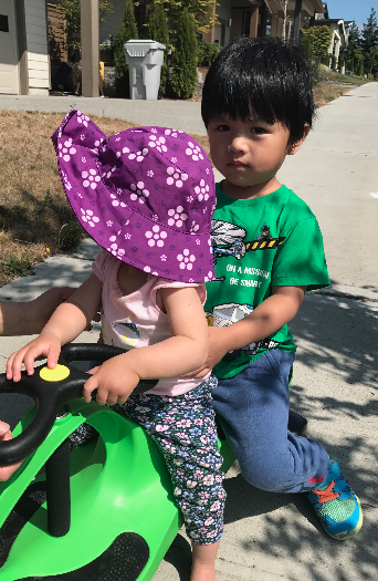 Phil on the PlasmaCar with a neighborhood baby :)