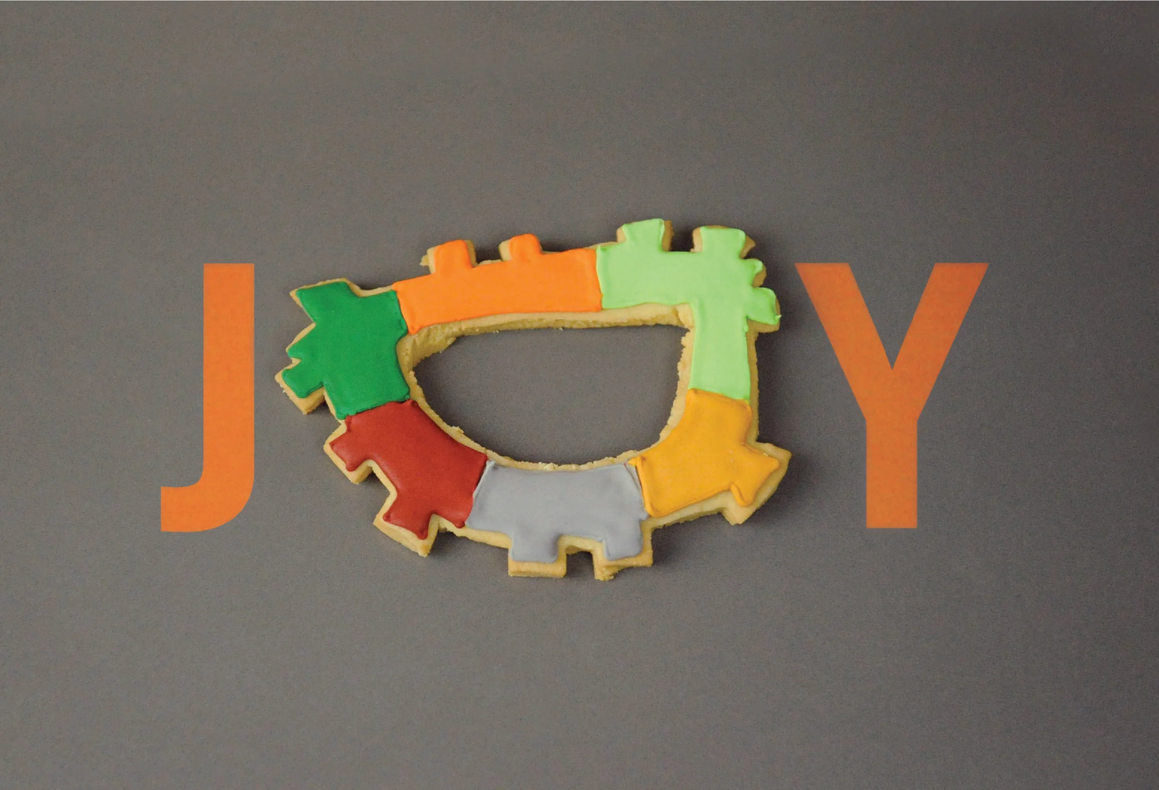 Holiday card with company icon as the "O" in "Joy"