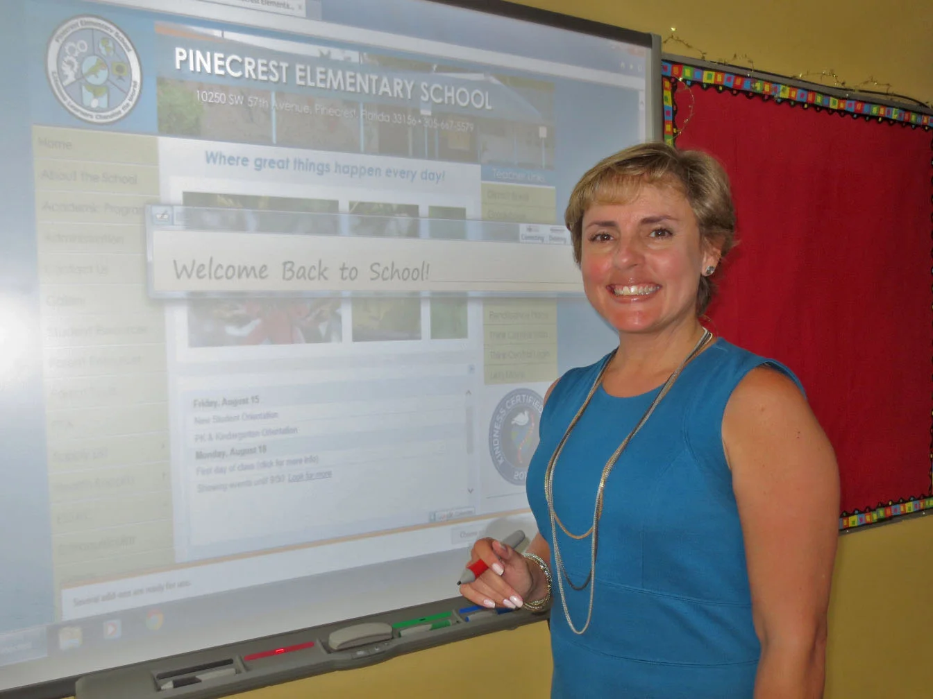 Pinecrest Elementary Principal Marisol Diaz at interactive smartboard