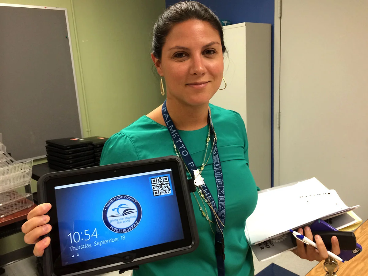 Assistant Principal Karina Menendez shows off the new tablets available to 9th graders