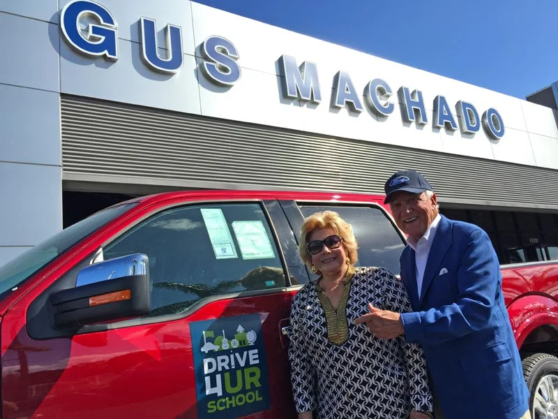 Lilliam and Gus Machado show off a new Ford