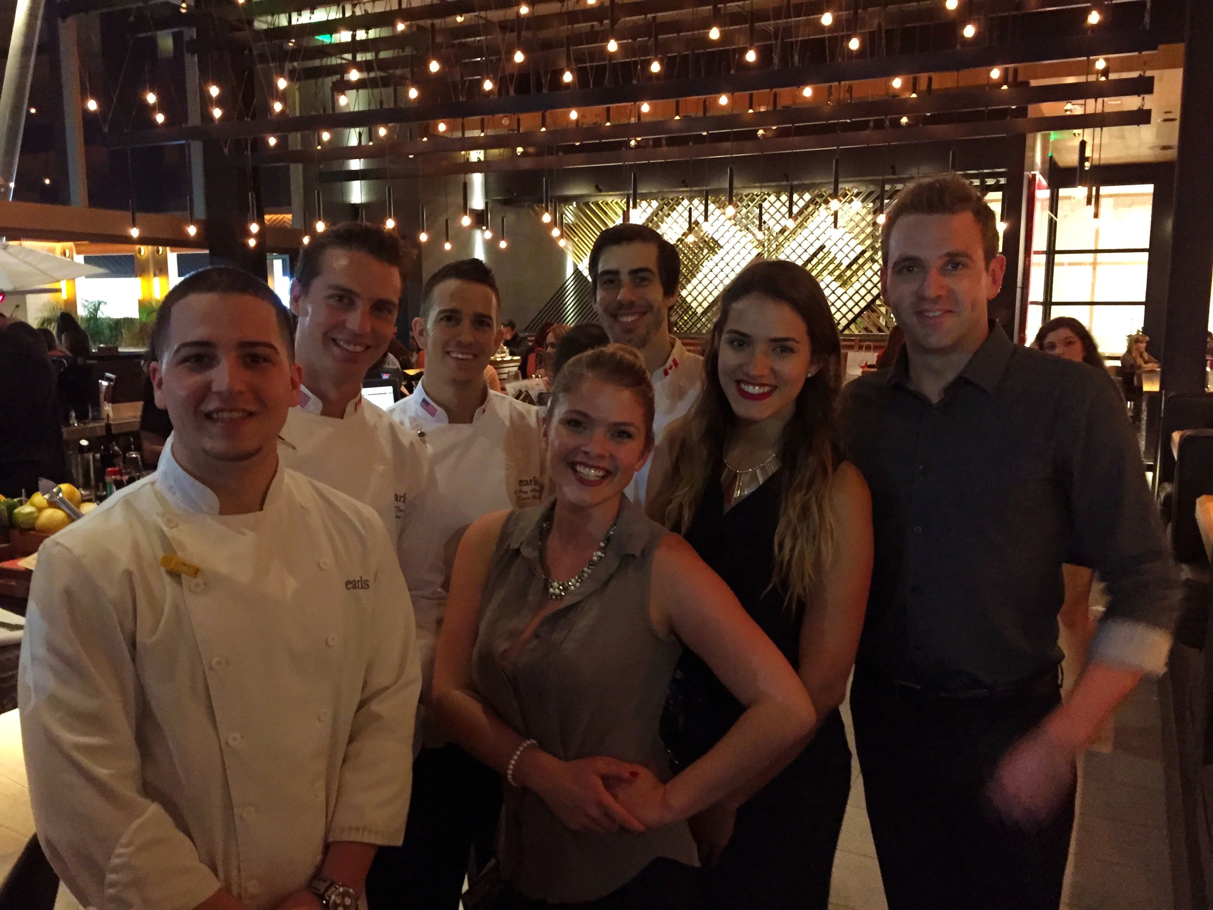 From center: Emily Scott, our server Diana and Andrew Goldsmith (and some of the chefs)