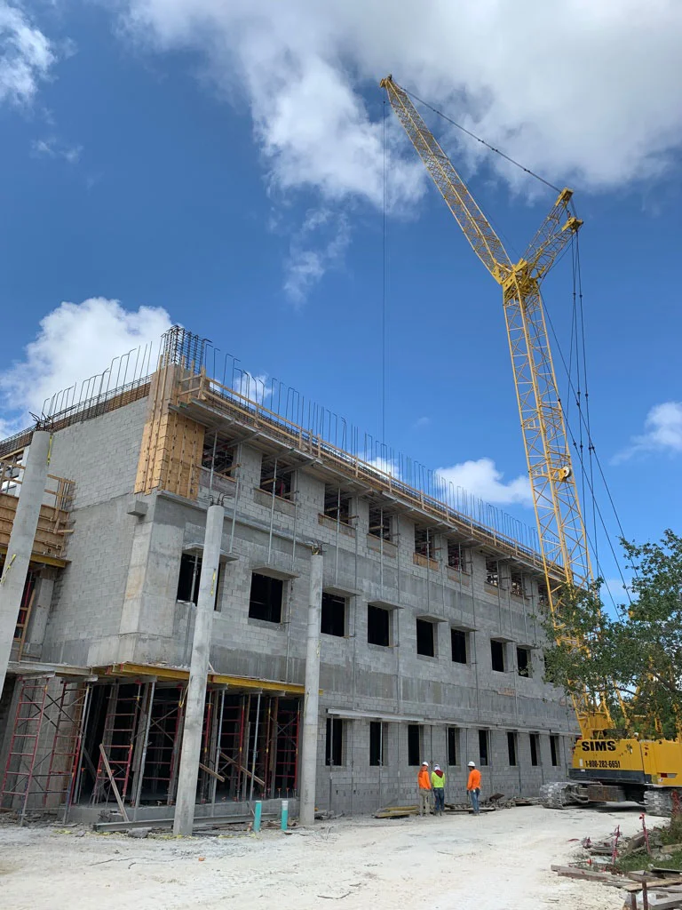 Crane putting beams in place for Building 1-A at Miami Palmetto Senior High School
