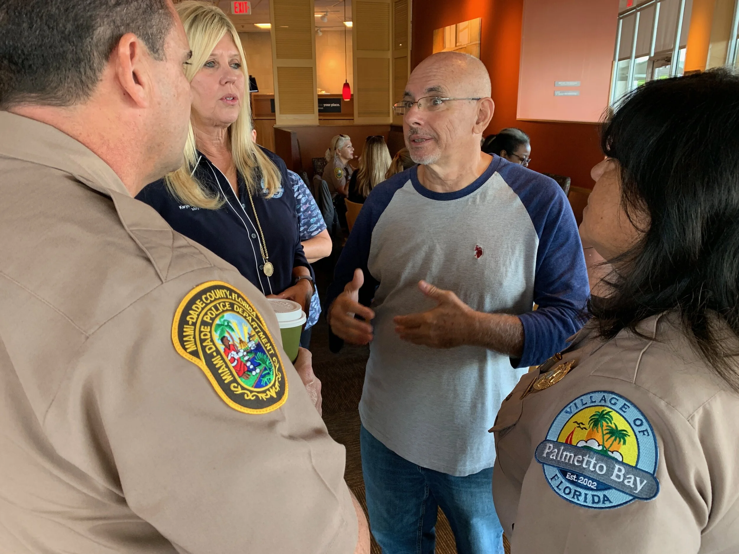 Heriberto Nunez engages with two officers