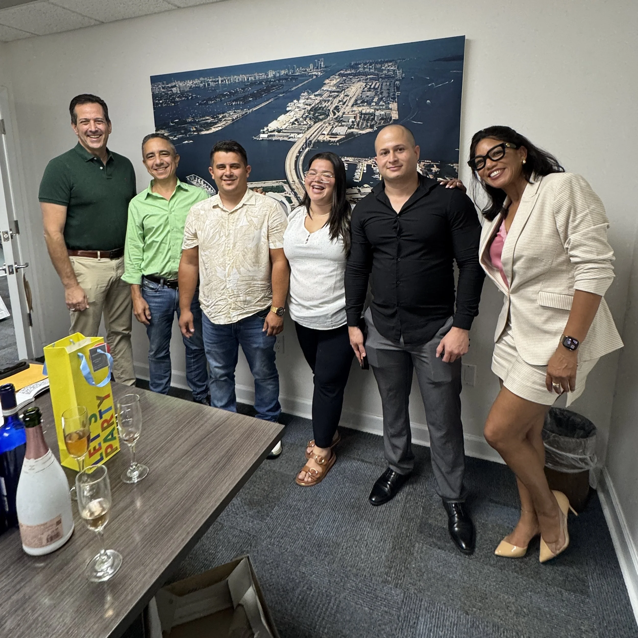 A rare full closing photo with buyer, seller, agents and lender.