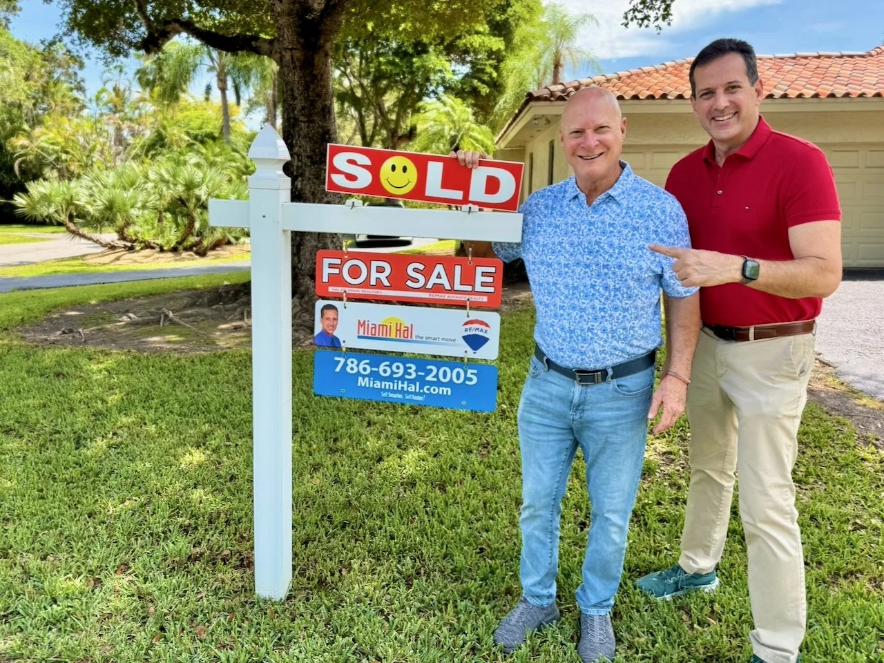 Matt and Hal add SOLD SIGN to the yard sign