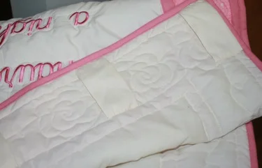 LOOPS ON ON QUILT BACK TO MAKE IT INTO A WALL HANGING