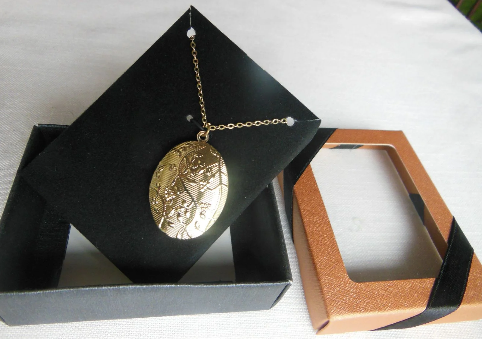 boxed gold tone locket