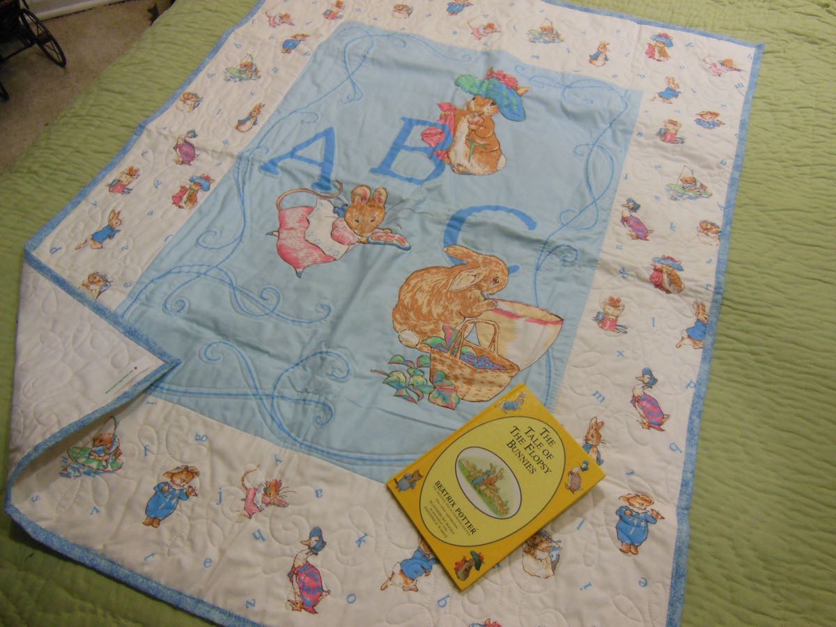 Peter Rabbit Crib Quilt with Book.jpg