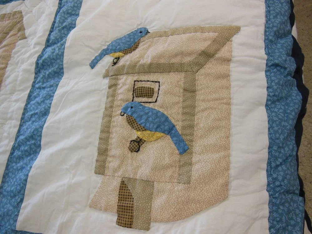 Birds applique king quilt at Bluebird Gardens