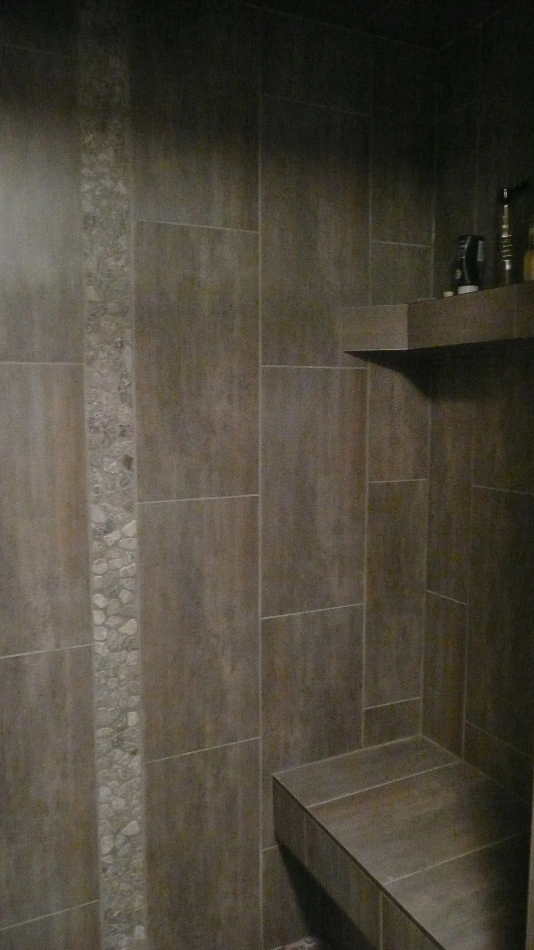 pebble+featrue+porcelain+shower+river+valley+renovation.jpg