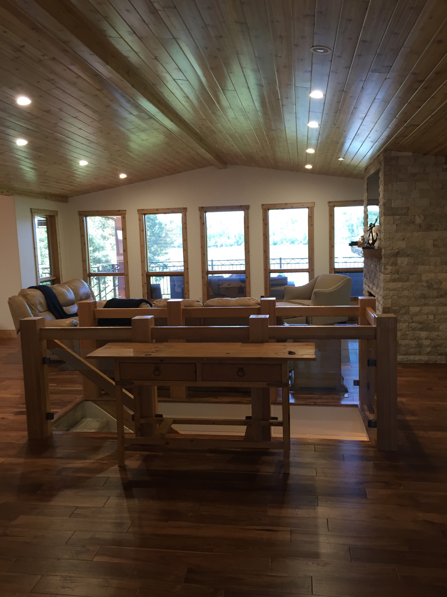 Open concept stair surround cedar posts and glass, cedar ceiling. 