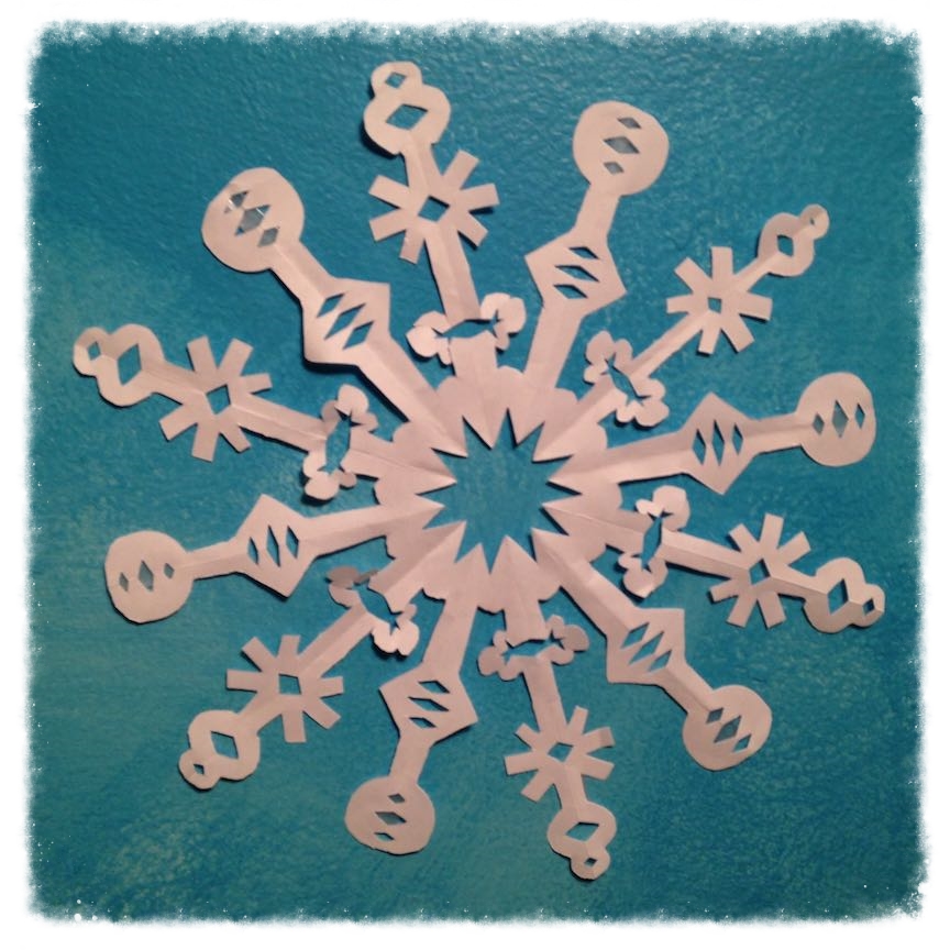 How to make a paper snowflake with six sides.