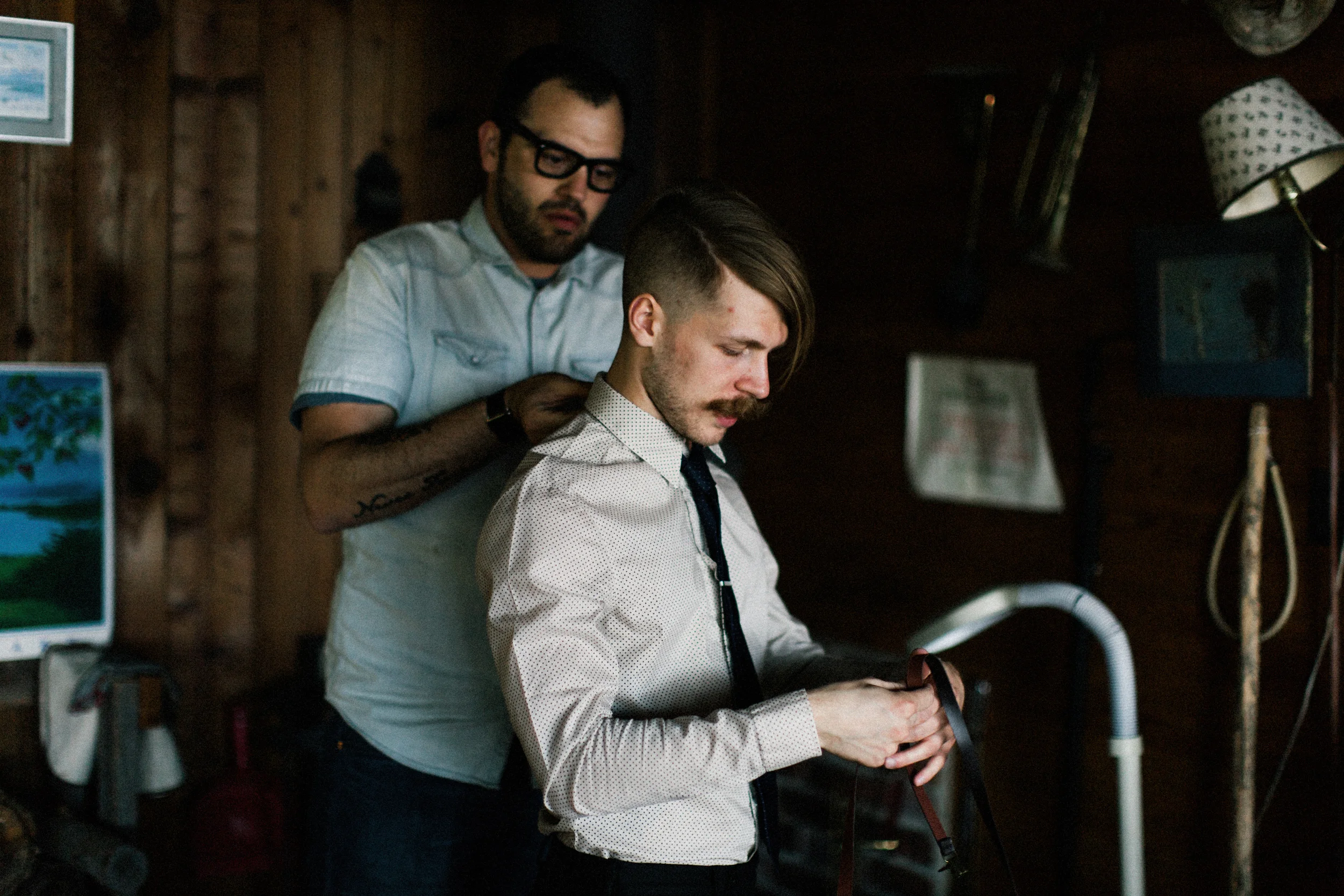 Groom getting ready in cabin
