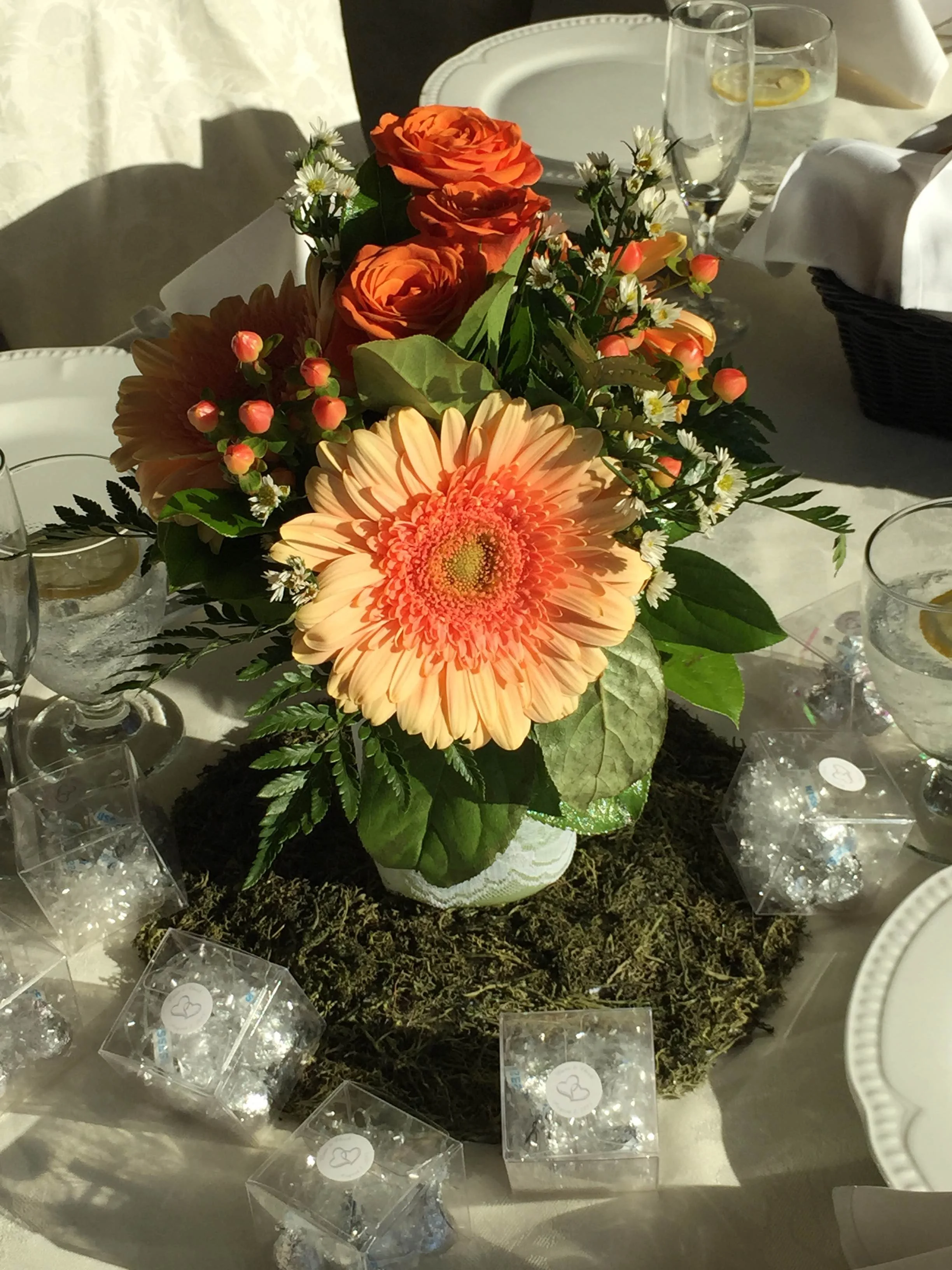 Evelisa Floral & Design's Coral & Mint mason jar Centerpiece.