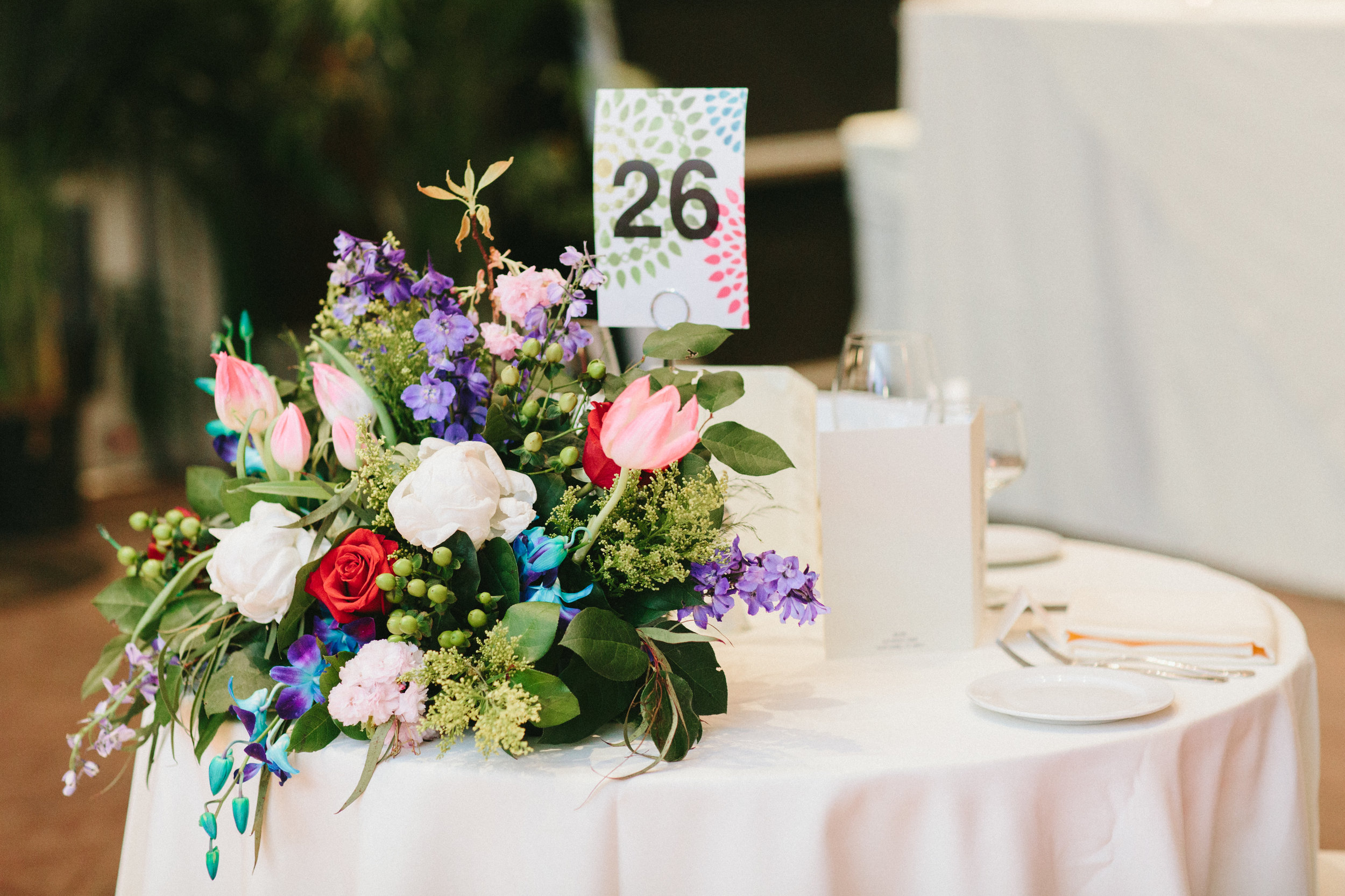 Evelisa Floral &amp; Design | Colorful Sweetheart table flowers 