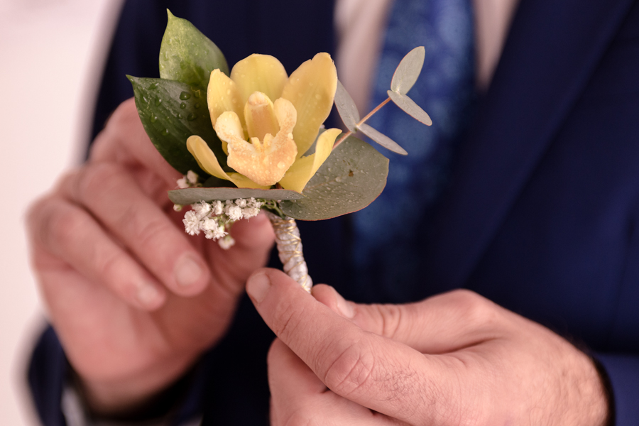 boutonniere and the grooms hands