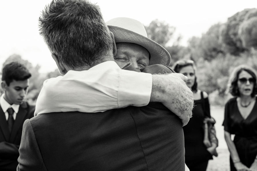 the grooms fathers hug