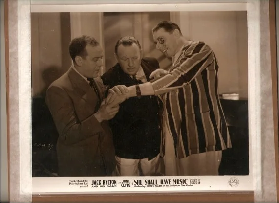 A publicity shot from the film "She Shall Have Music"