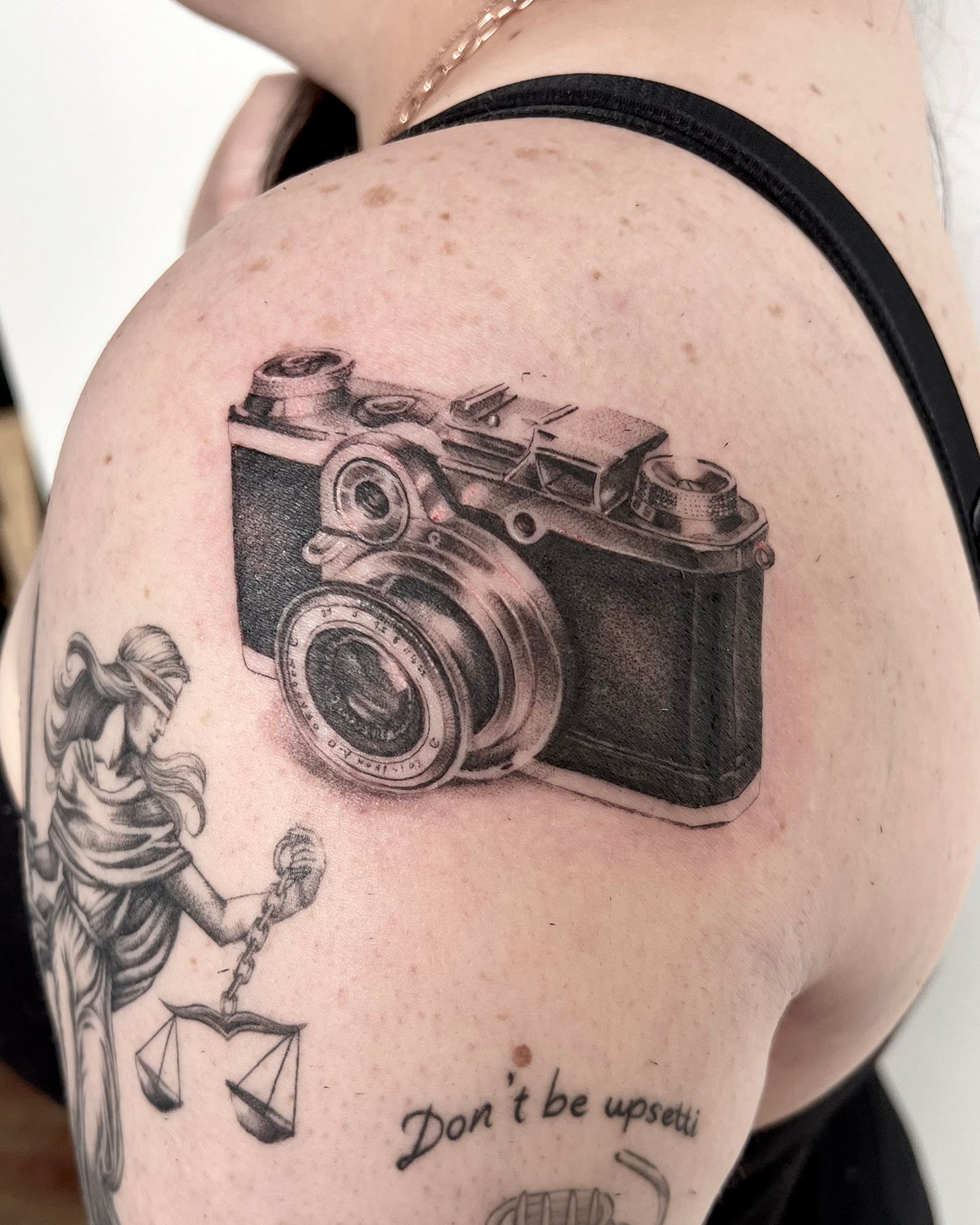 maddie-stanaland-black-grey-photo-realistic-camera-tattoo-daphne-alabama.jpg