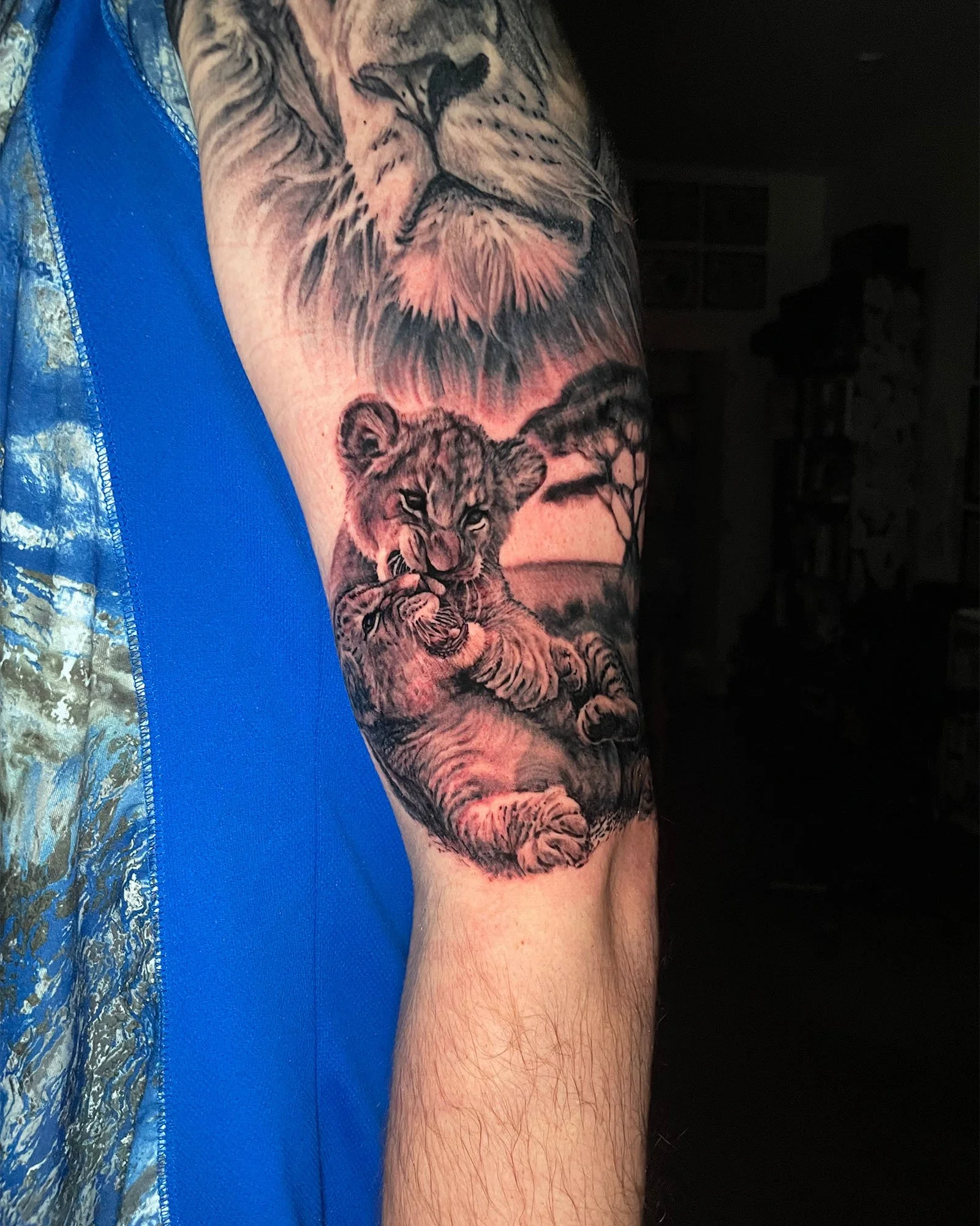 zach-long-black-grey-large-scale-lion-cub-tattoo-daphne-alabama.jpg