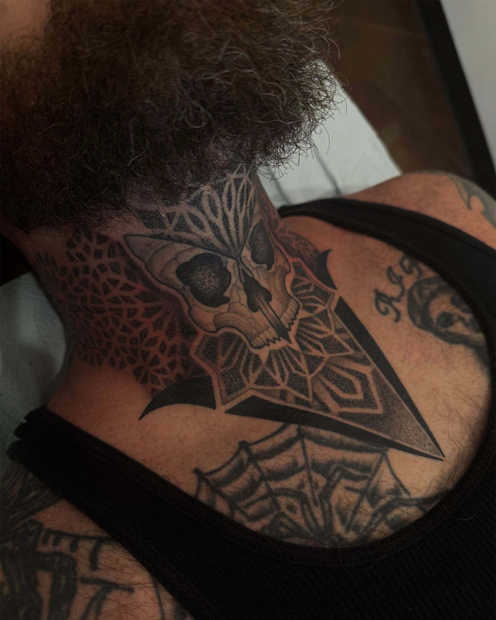 josey-yonge-black-grey-geometric-stippling-skull-tattoo-daphne-alabama.jpg