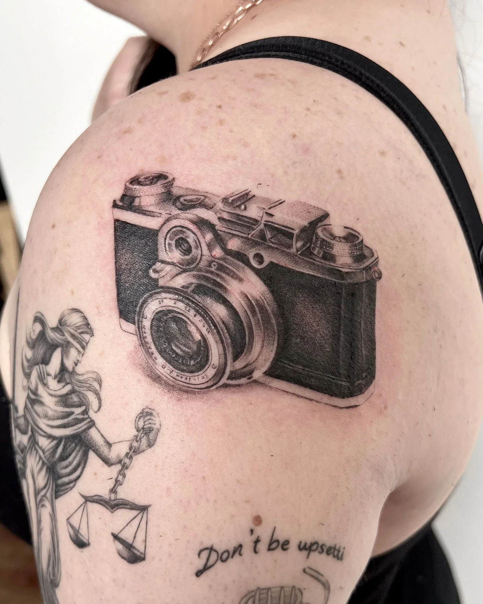 maddie-stanaland-black-grey-photo-realistic-camera-tattoo-daphne-alabama.jpg