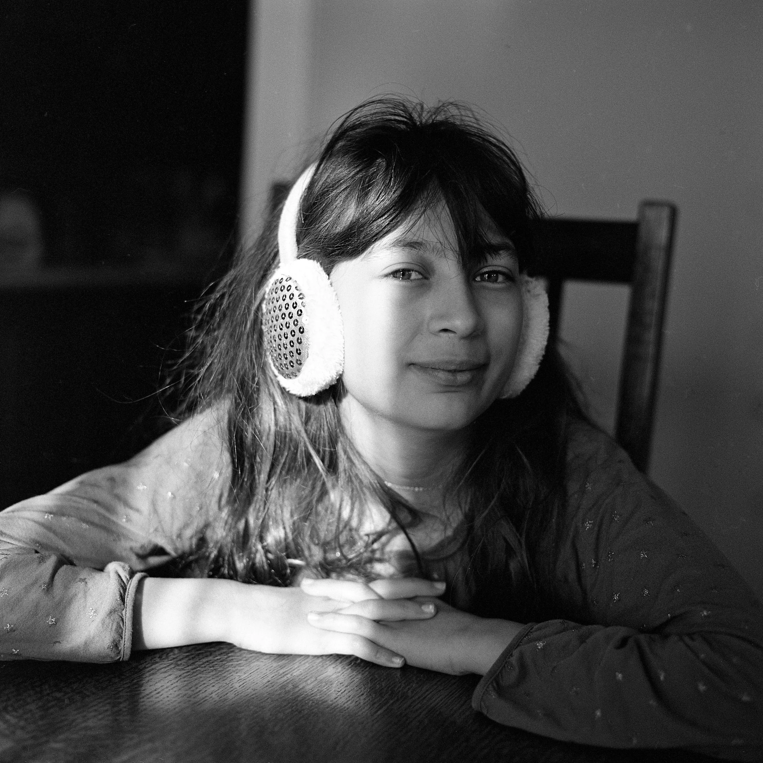 My daughter, Sofia, at the dining room table in early morning light. (Shot with a Rolleiflex 6008i medium format SLR camera and 80 mm f/2.8 lens on Tri-X 400 black-and-white film.)