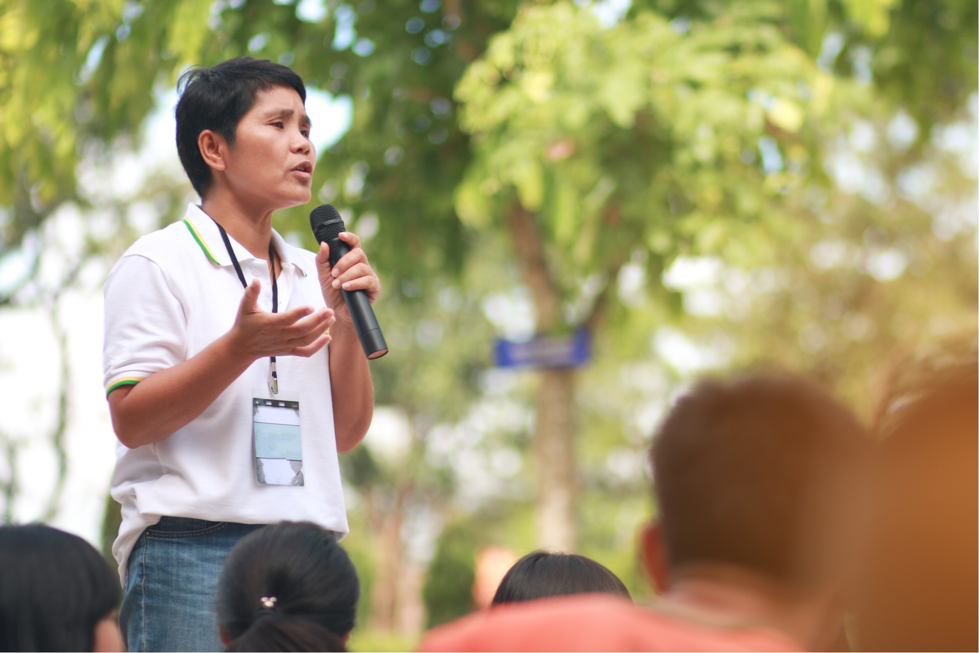 stock-photo-blurred-of-asian-thai-teachers-holding-a-microphone-teaching-students-and-speech-outside-the-531721099.jpg