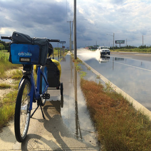 A flooded roadway and sidewalk makes for a tough crossing in West Atlantic City, NJ