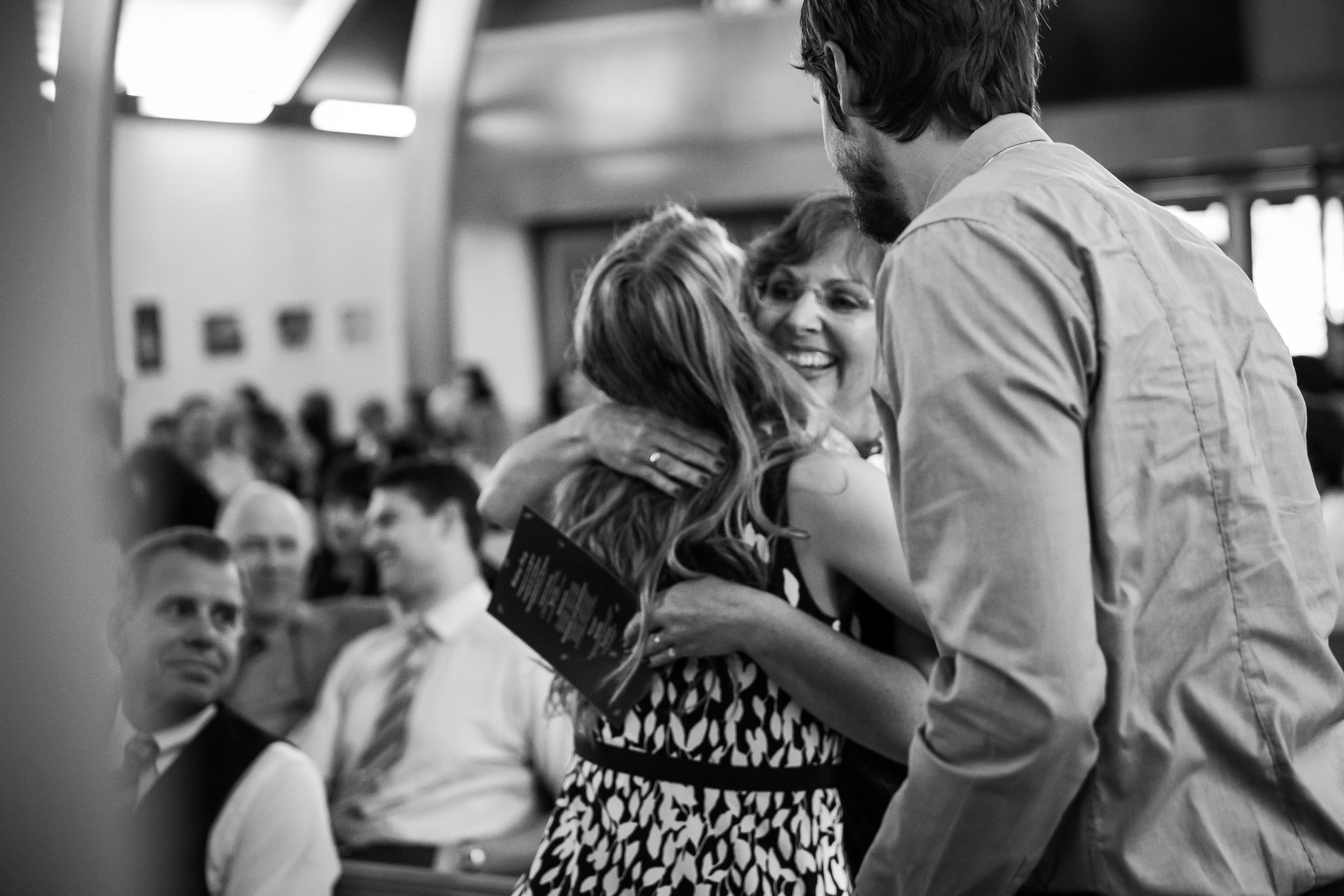 Seattle Community Church Wedding Photography | By G. Lin Photography | Mother of the bride hugging guest