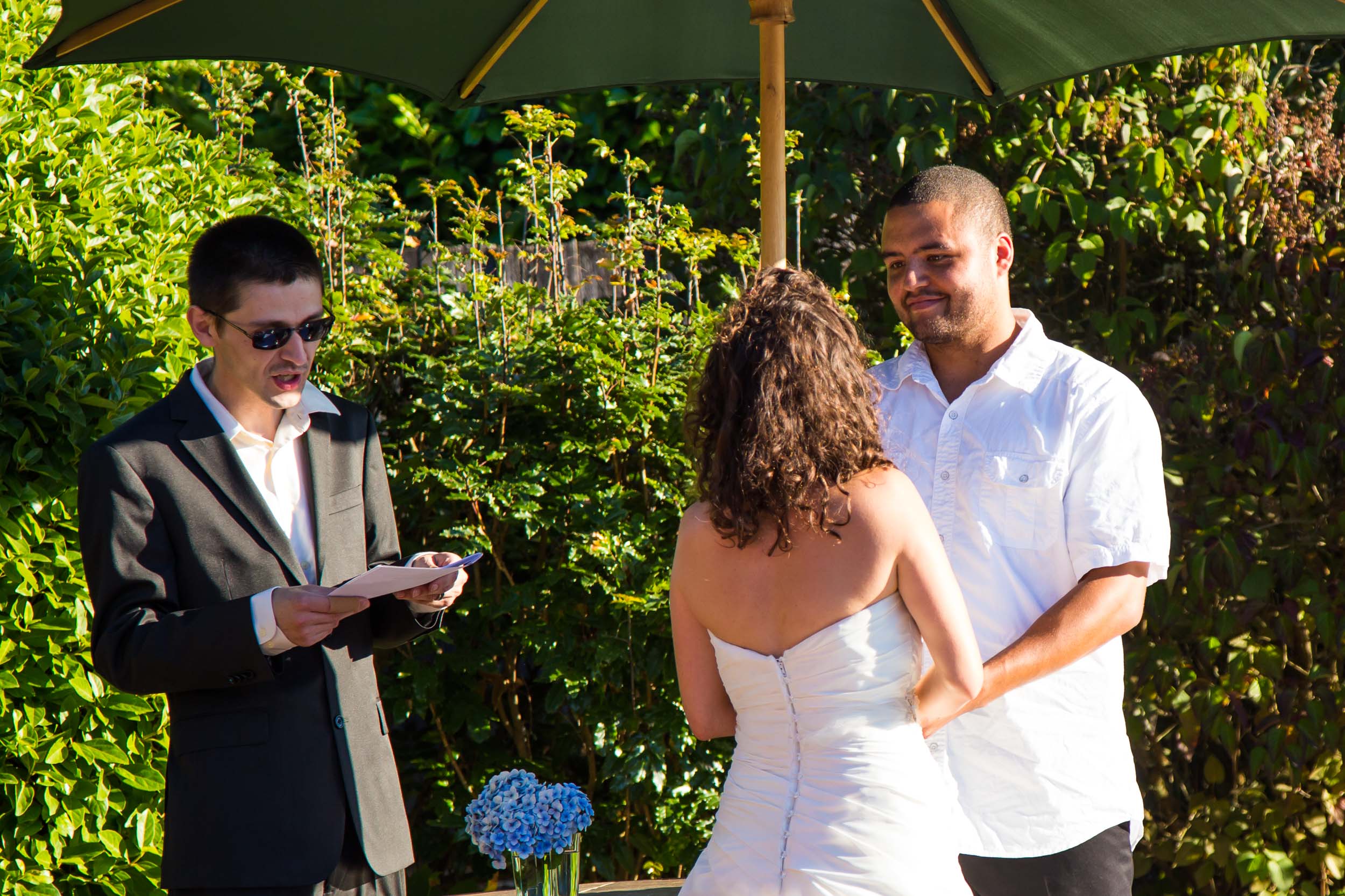 Seattle Wedding Photographer | By G. Lin Photography | Officiant reading to bride and groom