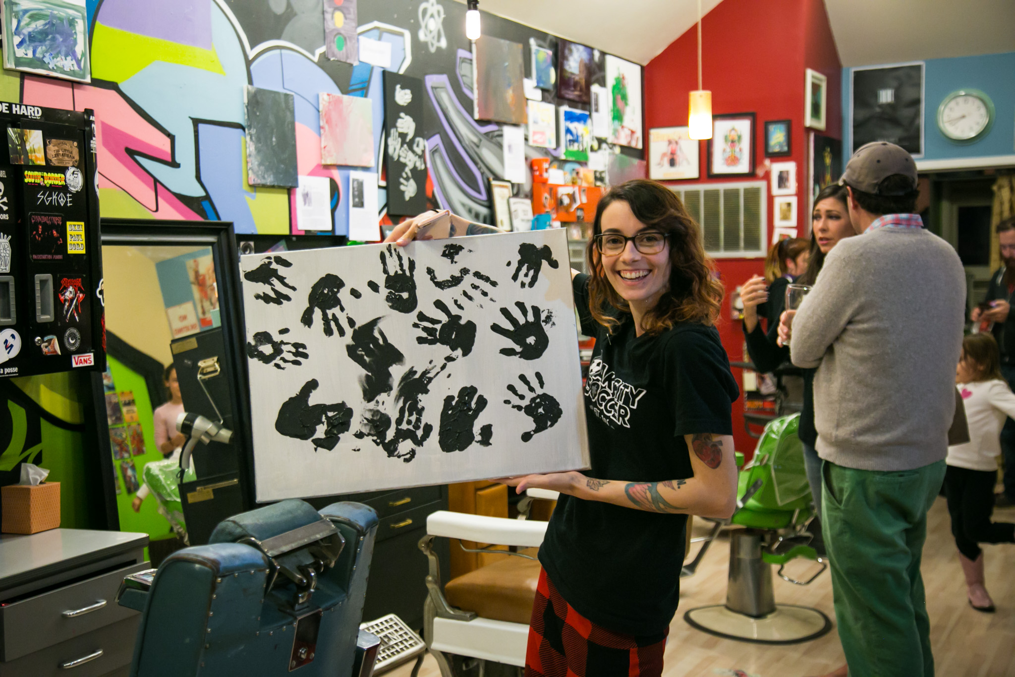 Raleigh Event Photographer | G. Lin Photography | Woman holding painting inside salon