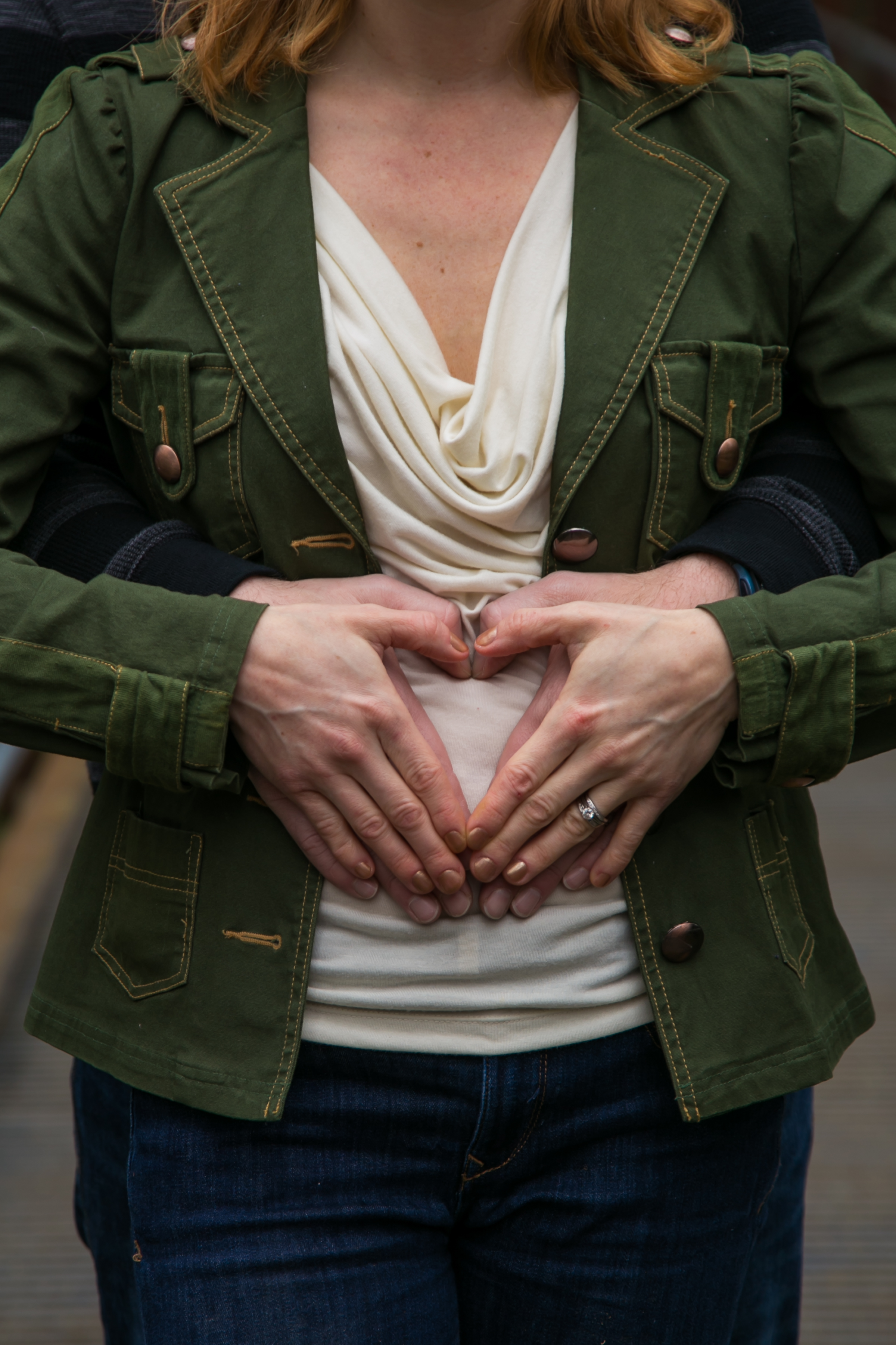 Seattle Family Photographer | G. Lin Photography | Woman making a heart shape figure with hands on belly