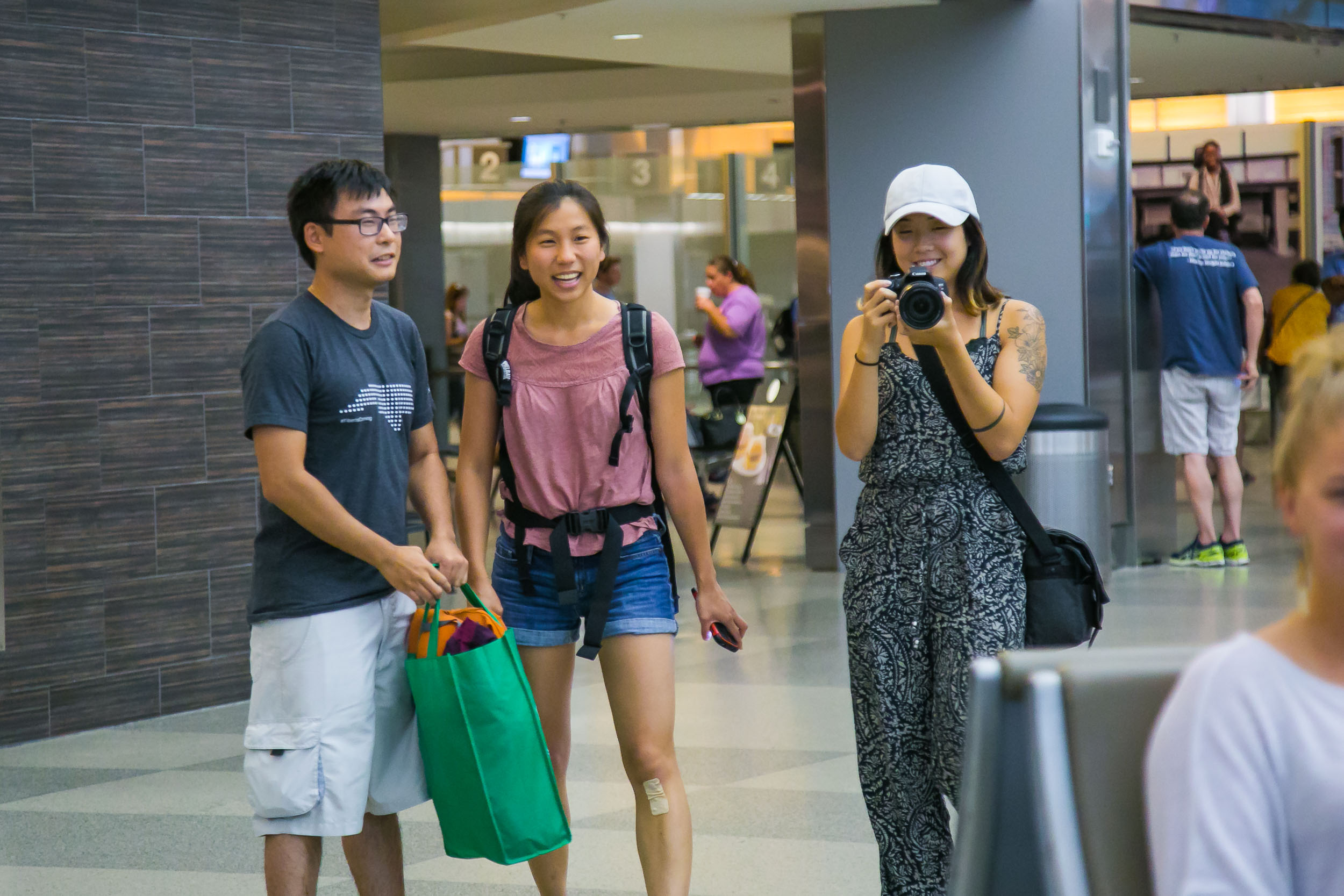 Raleigh Engagement Photographer | G. Lin Photography | People standing at arrivals at airport