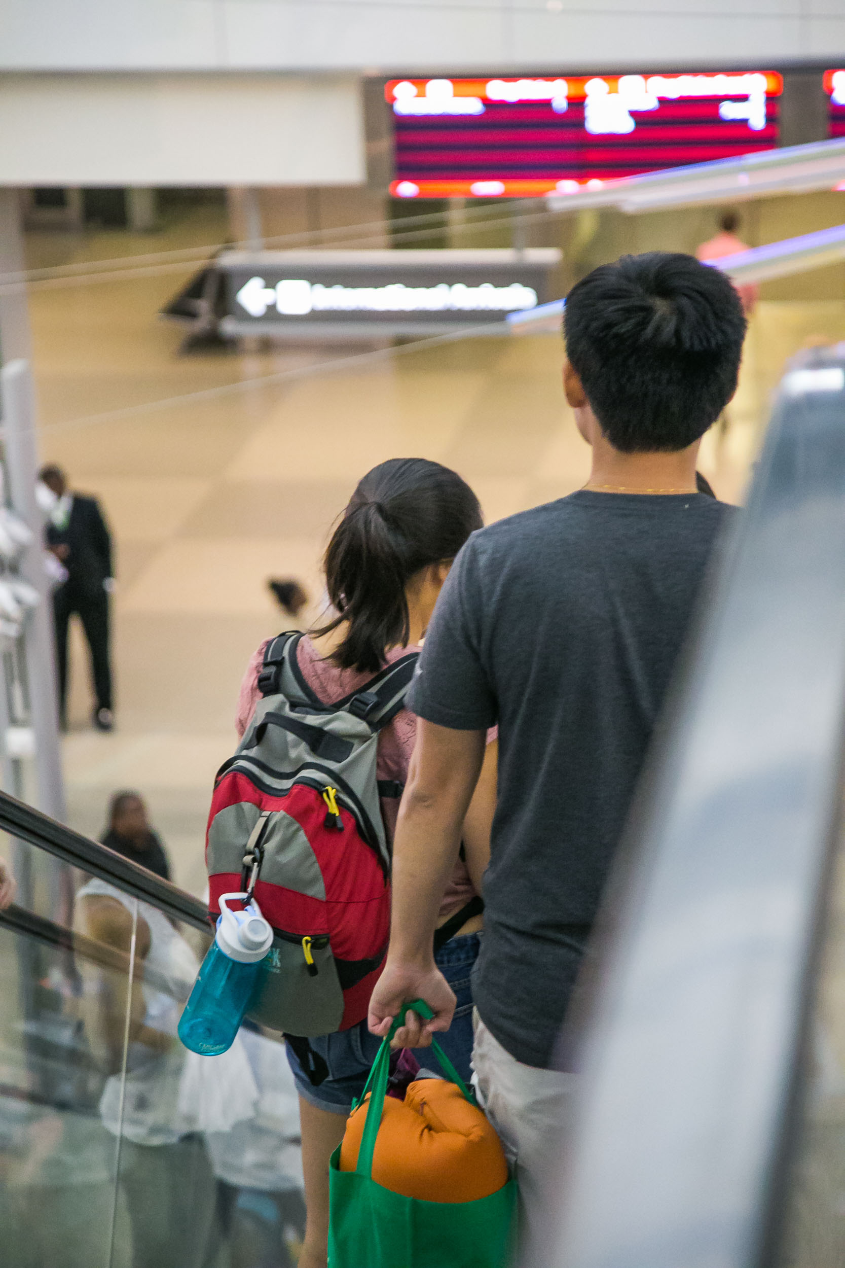 Raleigh Engagement Photographer | G. Lin Photography | People going down the escalator