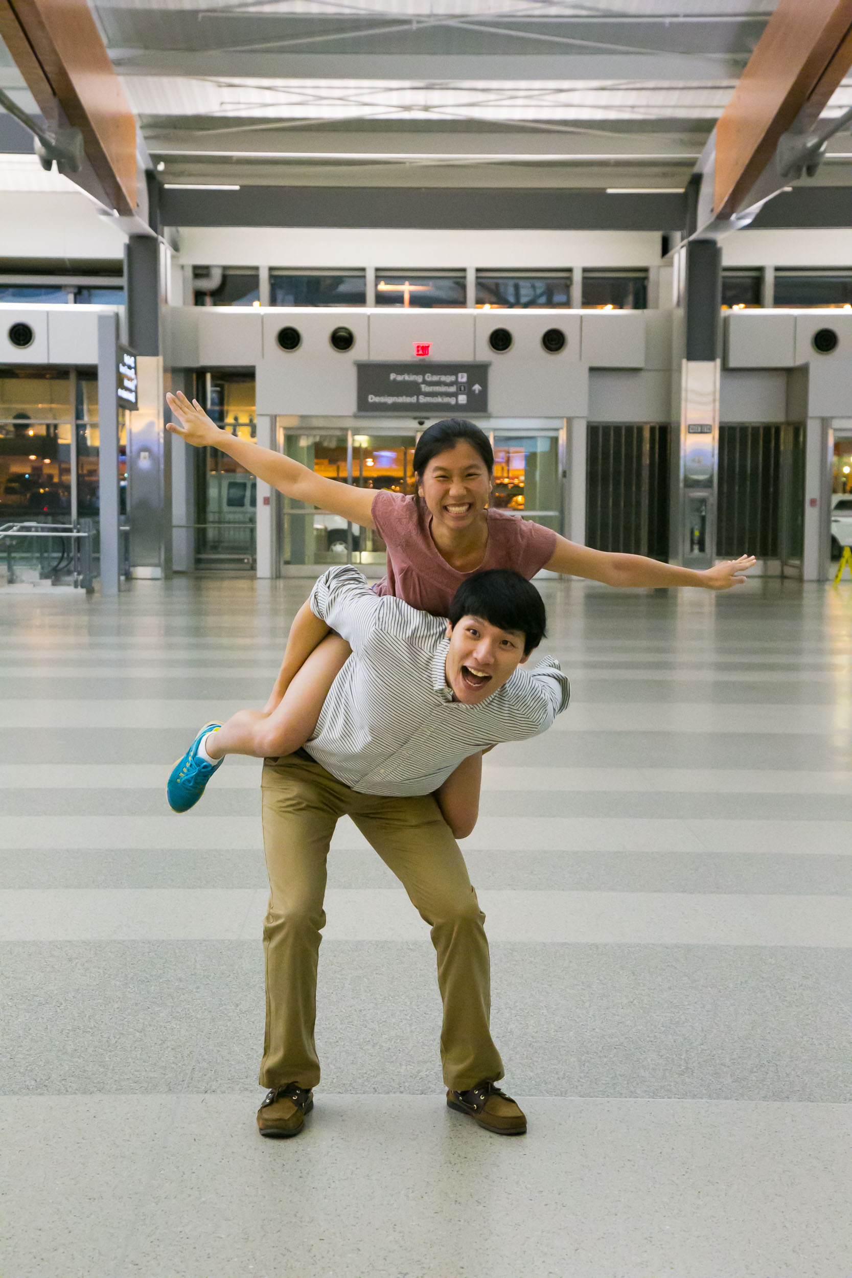 Raleigh Engagement Photographer | G. Lin Photography | Portrait of man and woman at airport