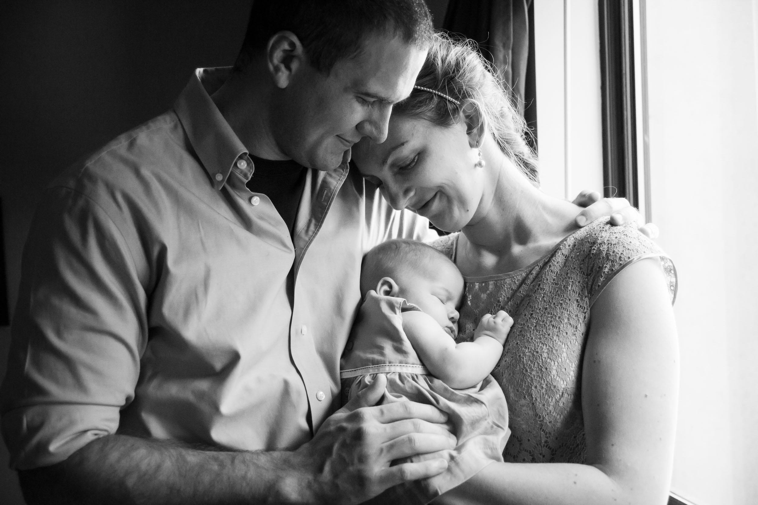 Seattle Family Photographer | By G. Lin Photography | Black and white image of parents holding baby