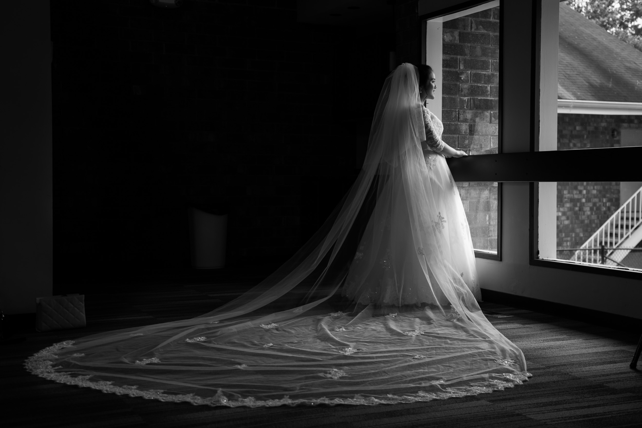 Raleigh Wedding Photographer | G. Lin Photography | Bride standing by window looking outside