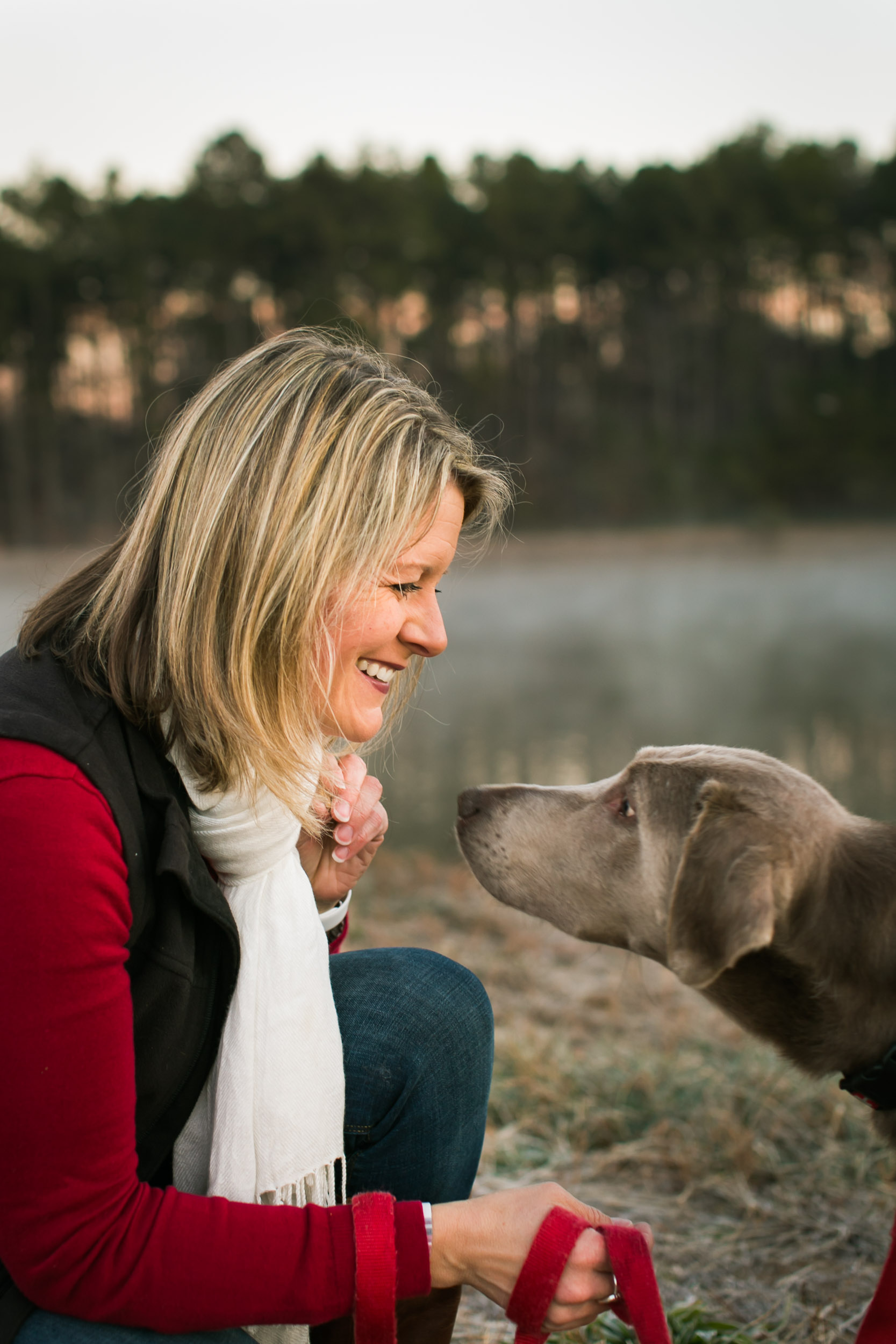 Durham Family Photographer | G. Lin Photography | Woman and dog smiling in park