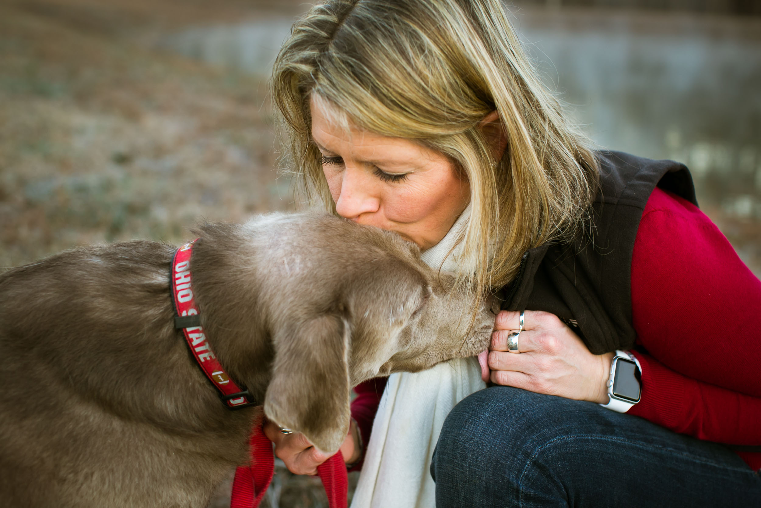 Durham Family Photographer | G. Lin Photography | Woman kissing dog's head 