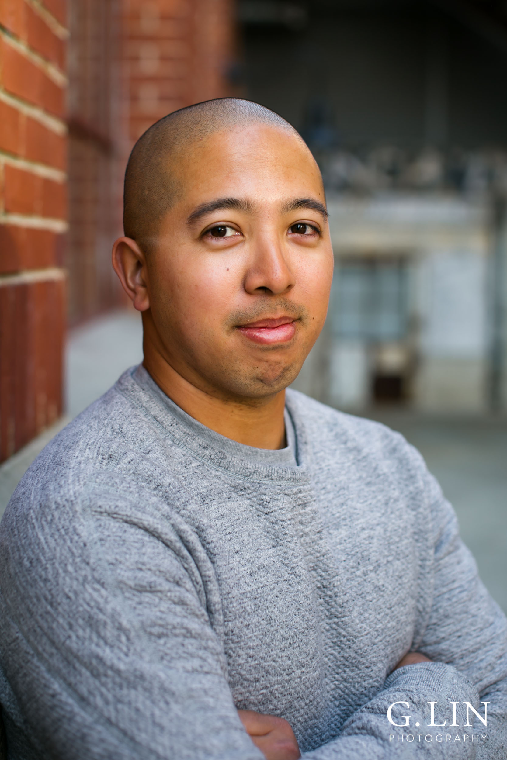 Durham Family Photographer | G. Lin Photography | Man leaning on wall with arms folded